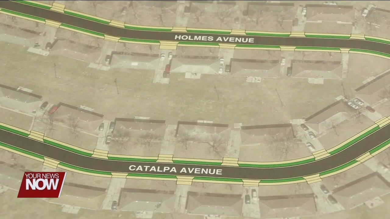 Residents and city officials discuss the Catalpa and Holmes Reconstruction Project